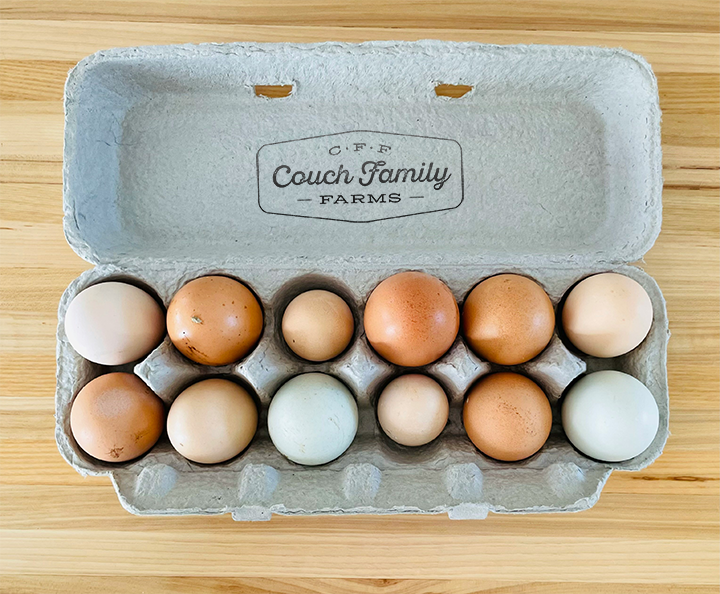 Couch Family Farm Egg Carton a dozen eggs in open egg carton with couch family farms logo